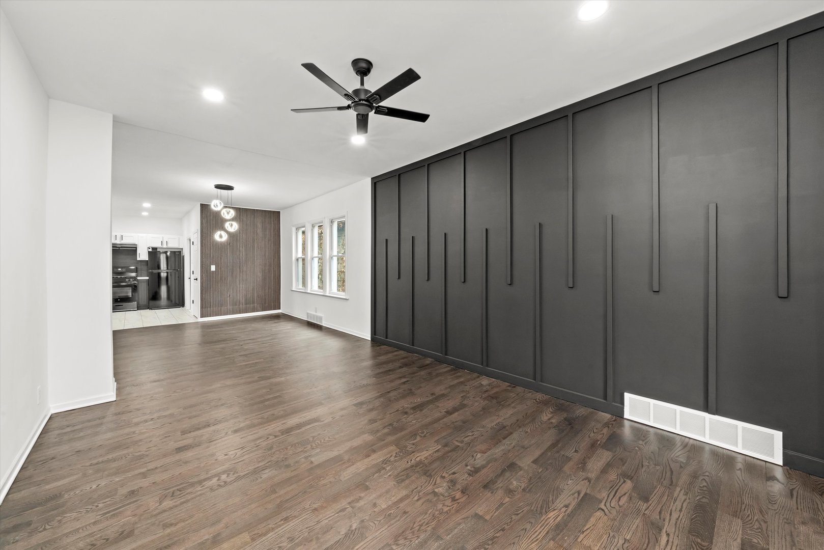 140 West 110th Street Chicago, IL 60628 - Photo 2 of 54 a view of a livingroom with a hardwood floor and staircase