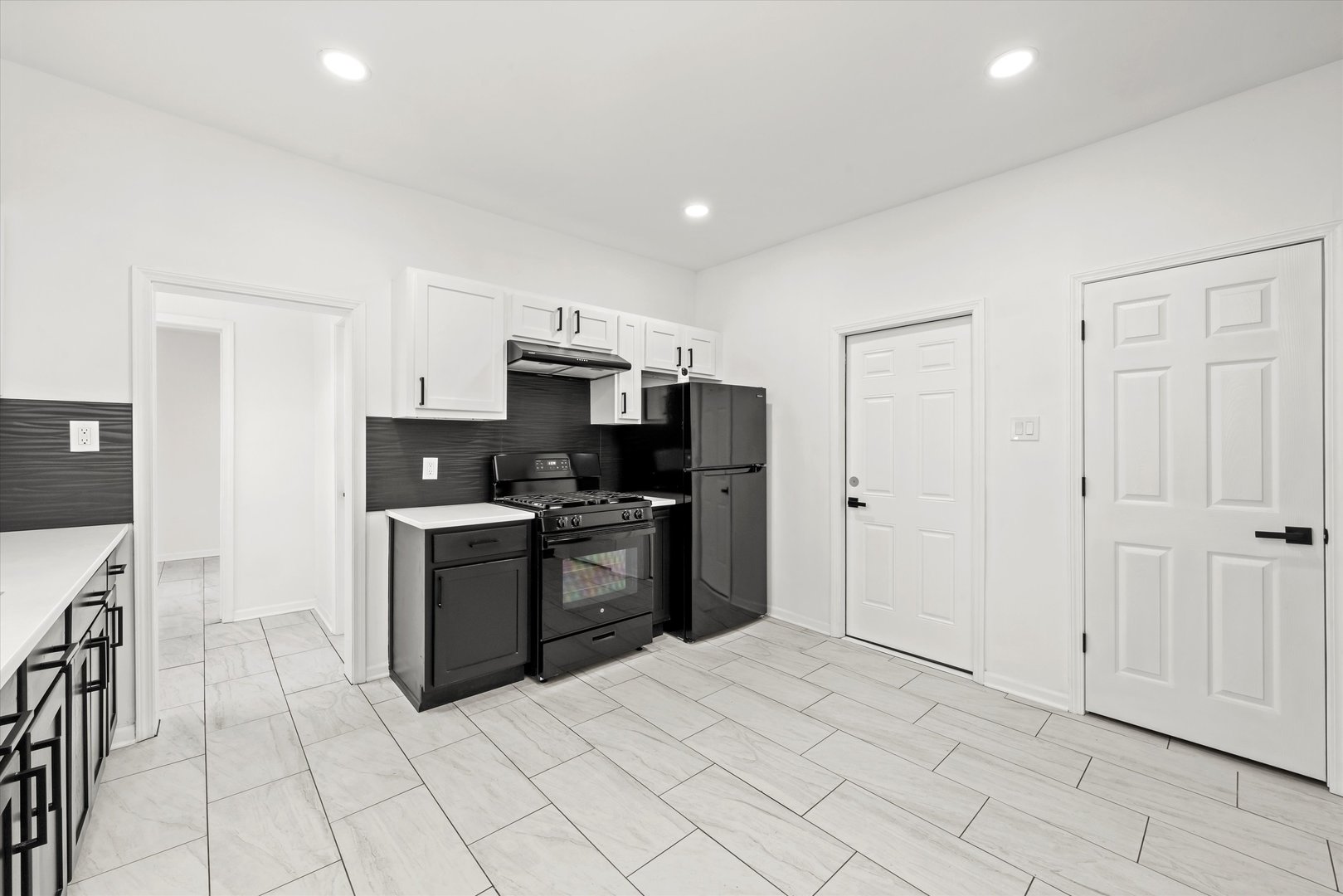 140 West 110th Street Chicago, IL 60628 - Photo 23 of 54 a kitchen with stainless steel appliances a refrigerator sink and cabinets