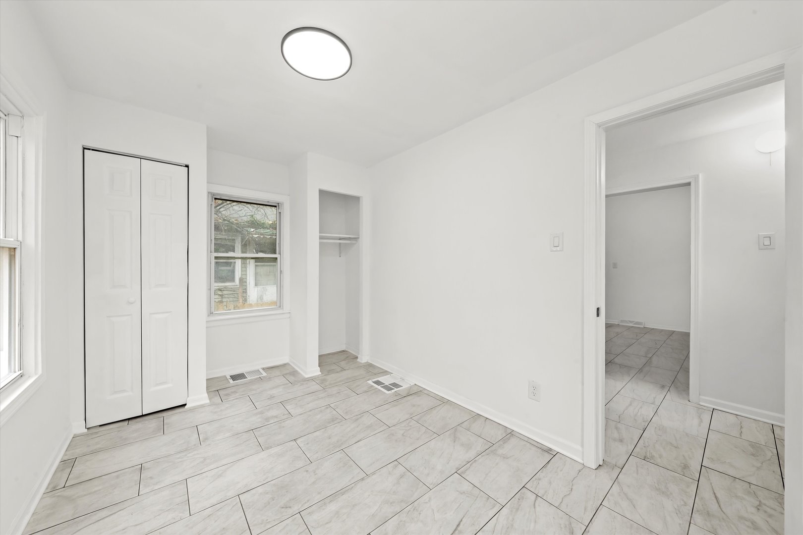 140 West 110th Street Chicago, IL 60628 - Photo 27 of 54 an empty room with windows and closet