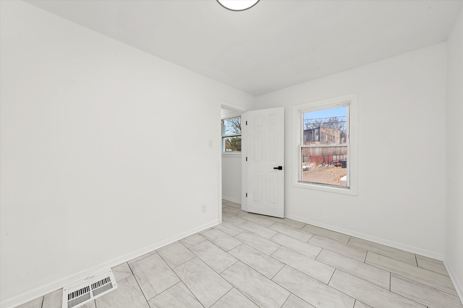 140 West 110th Street Chicago, IL 60628 - Photo 29 of 54 an empty room with windows