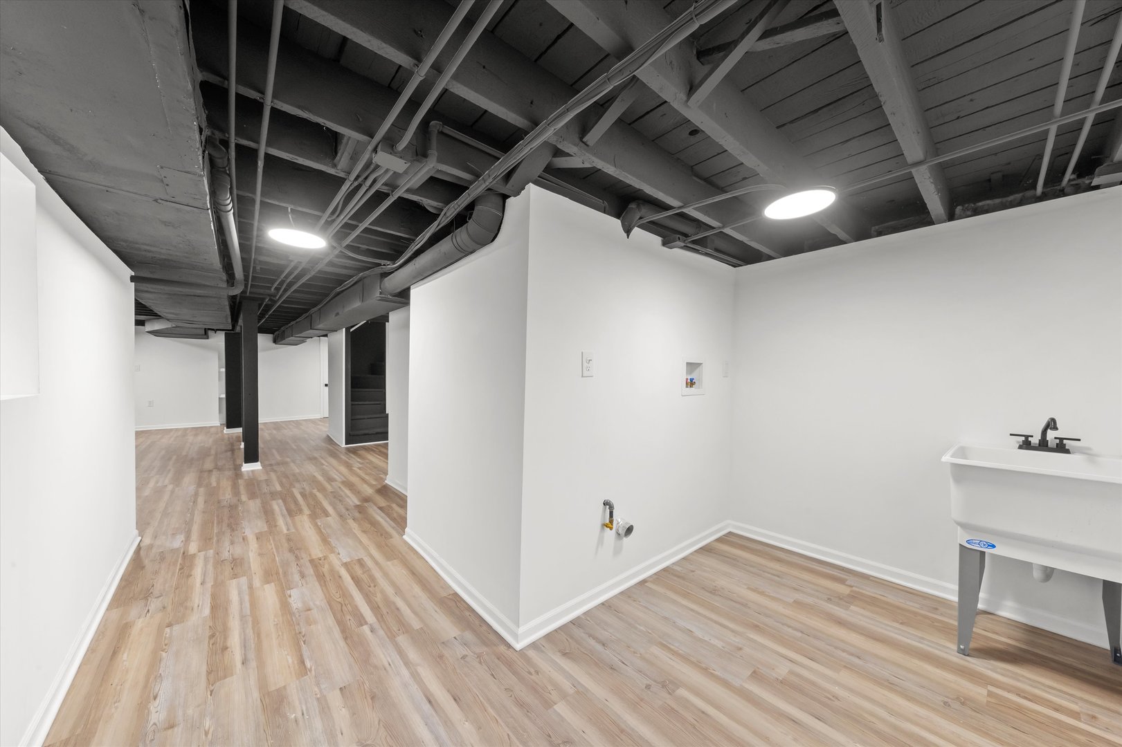 140 West 110th Street Chicago, IL 60628 - Photo 34 of 54 a view of an empty room with wooden floor