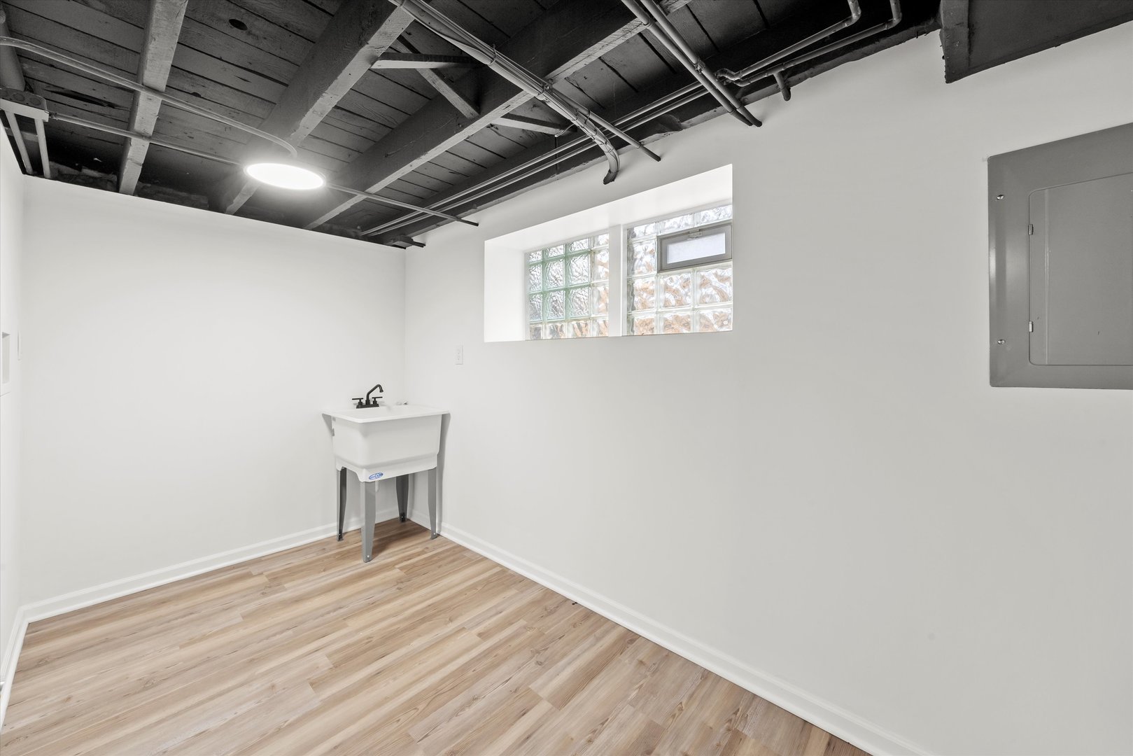 140 West 110th Street Chicago, IL 60628 - Photo 35 of 54 a view of a room with wooden floor