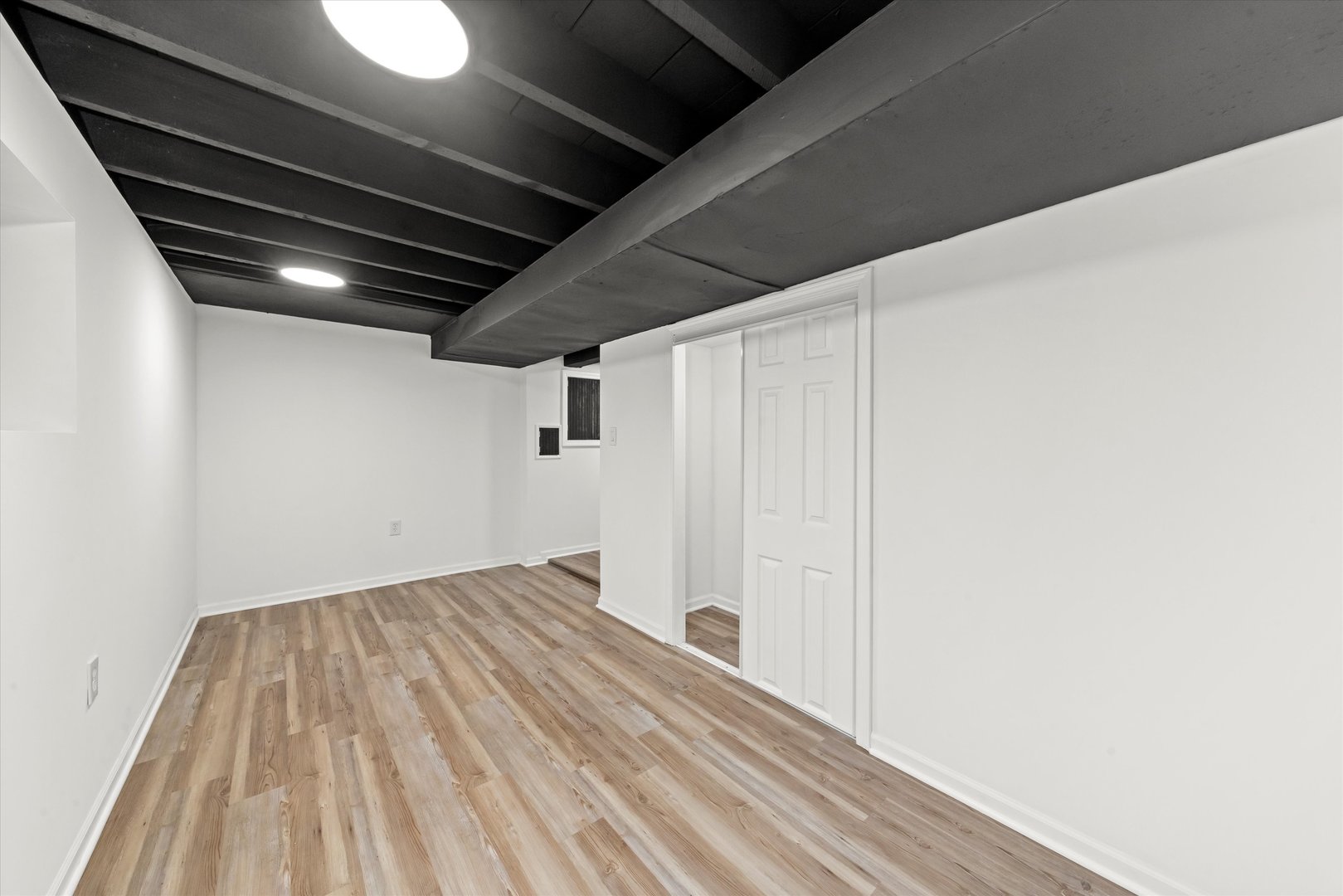 140 West 110th Street Chicago, IL 60628 - Photo 38 of 54 a view of empty room with wooden floor