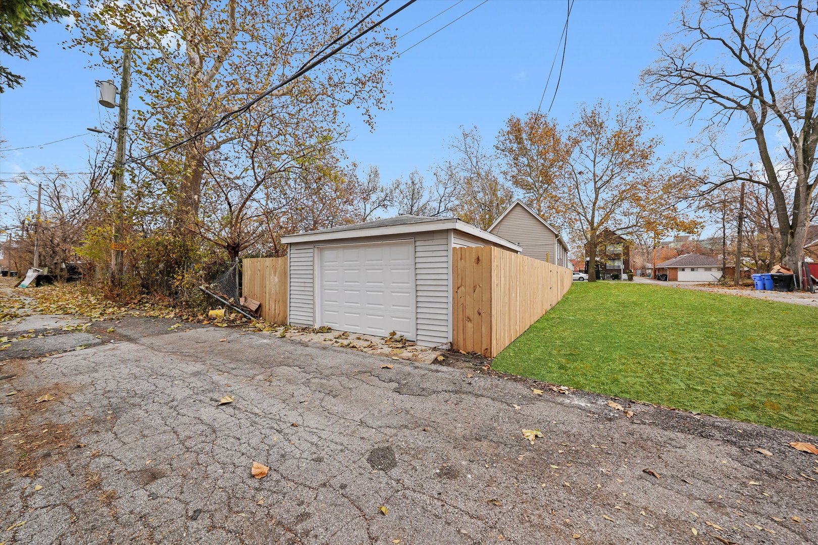 140 West 110th Street Chicago, IL 60628 - Photo 47 of 54 a view of a house with a yard and garage