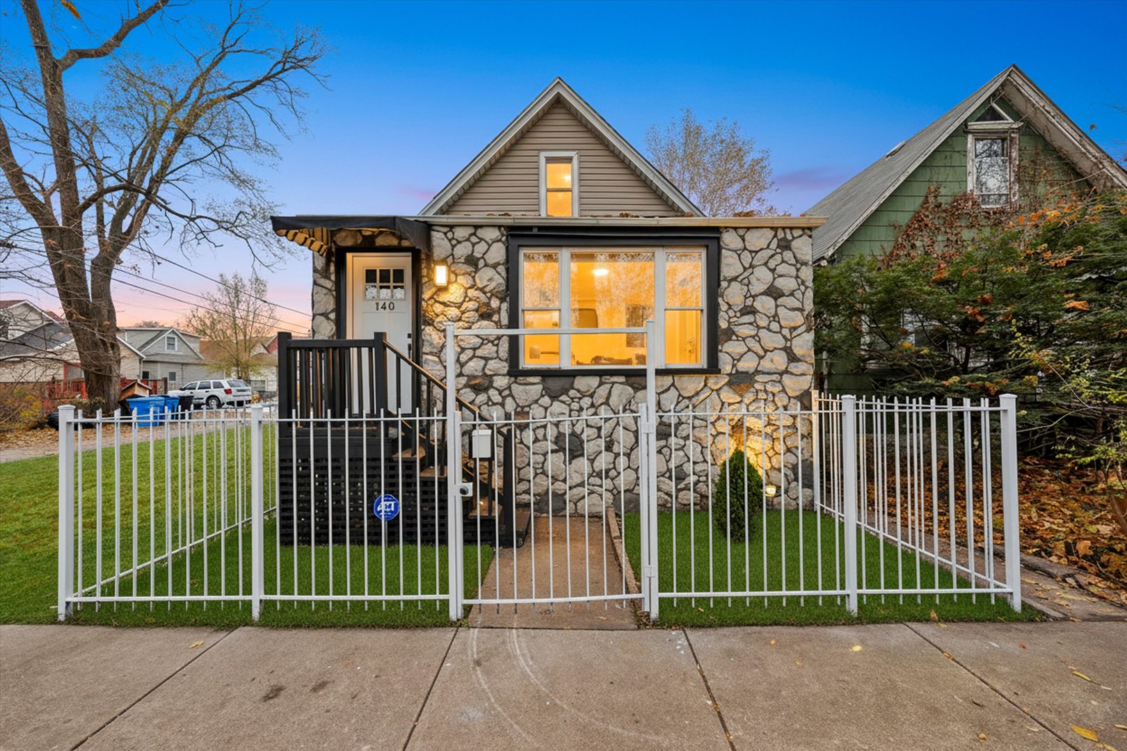 140 West 110th Street Chicago, IL 60628 - Photo 51 of 54 a front view of a house with a garden