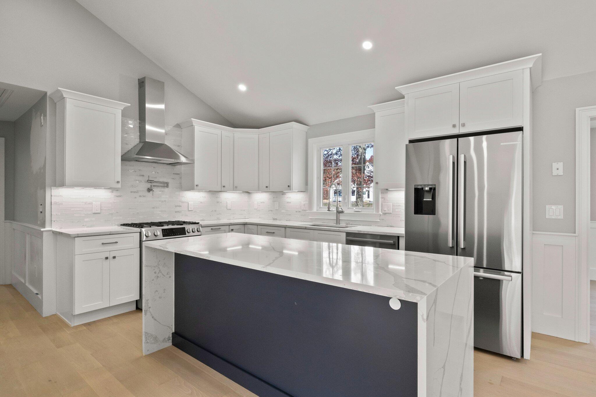 197 Old Barnstable Road Mashpee, MA 02649 - Photo 14 of 50 a kitchen with stainless steel appliances granite countertop a stove a refrigerator and a sink