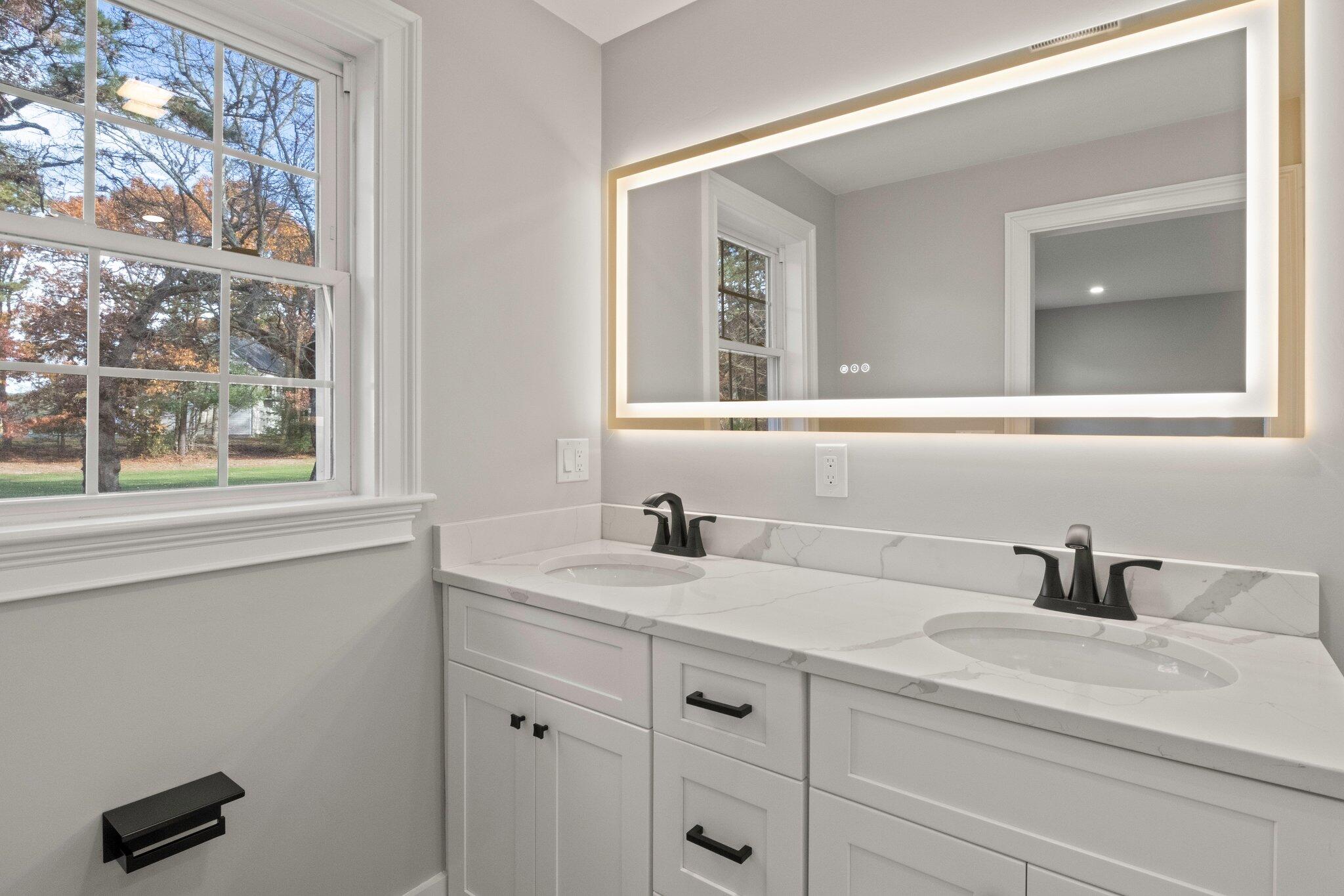 197 Old Barnstable Road Mashpee, MA 02649 - Photo 33 of 50 a bathroom with a sink and a mirror