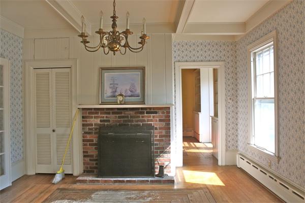 189 Highland Road Tiverton, RI 02878 - Photo 11 of 25 a view of an entryway with a fireplace