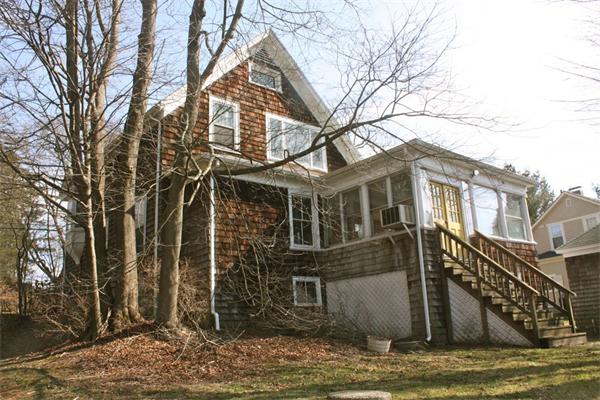 189 Highland Road Tiverton, RI 02878 - Photo 3 of 25 a view of a building with a yard