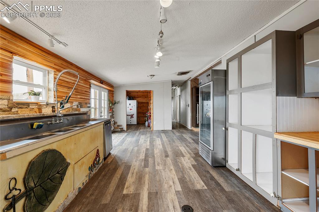 31995 North Neely Road Yoder, CO 80864 - Photo 11 of 46 a view of a kitchen with a sink wooden floor and cabinets