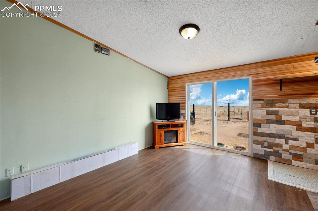 31995 North Neely Road Yoder, CO 80864 - Photo 15 of 46 a view of a livingroom with hardwood and furniture