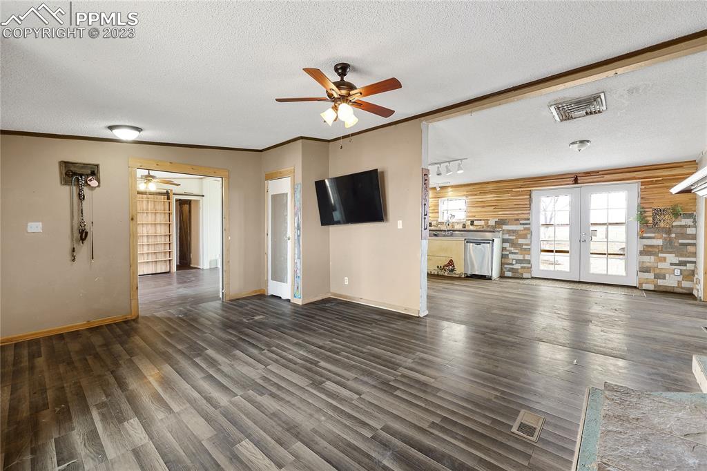 31995 North Neely Road Yoder, CO 80864 - Photo 3 of 46 a view of an empty room with wooden floor and a window