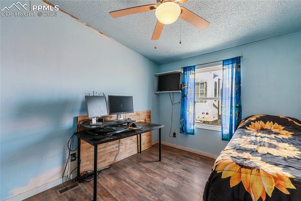 31995 North Neely Road Yoder, CO 80864 - Photo 37 of 46 a bedroom with furniture and a window