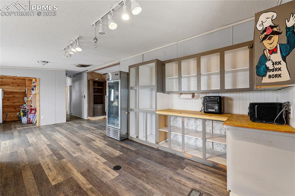 31995 North Neely Road Yoder, CO 80864 - Photo 9 of 46 a view of a kitchen with a sink and a refrigerator