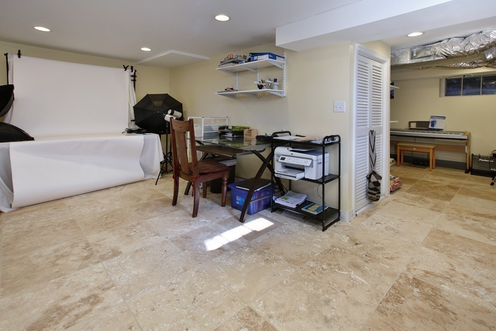 55 Bay State Road Arlington, MA 02474 - Photo 13 of 20 a living room with furniture and a flat screen tv