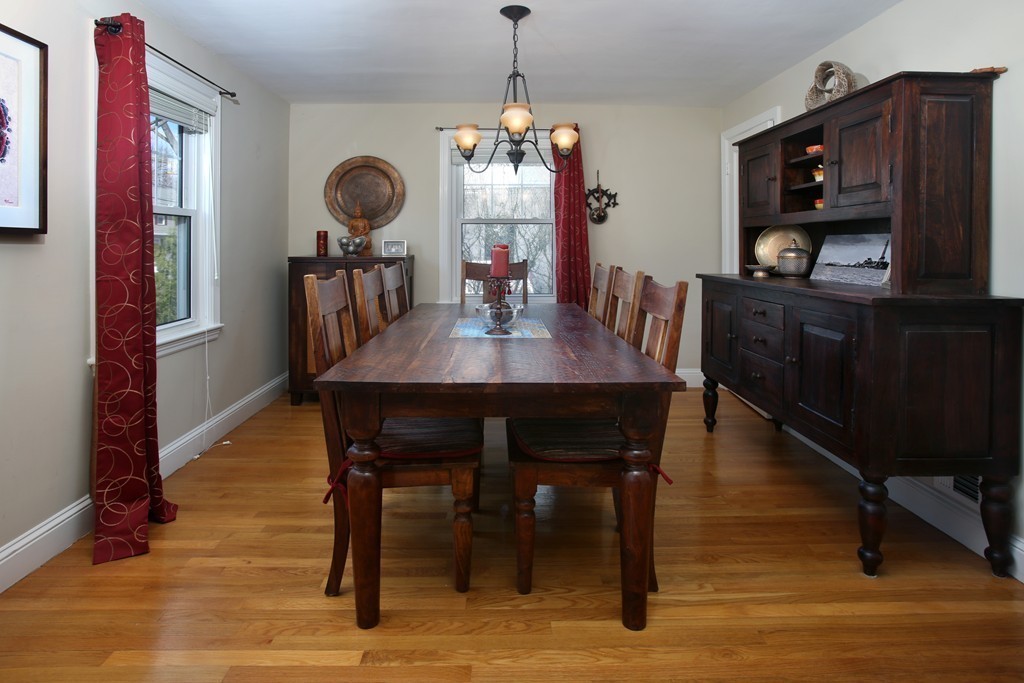 55 Bay State Road Arlington, MA 02474 - Photo 4 of 20 a view of a dining room with furniture and wooden floor