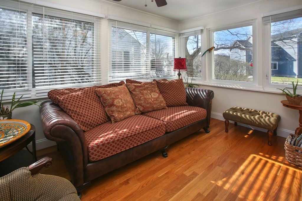 55 Bay State Road Arlington, MA 02474 - Photo 5 of 20 a living room with furniture and a large window