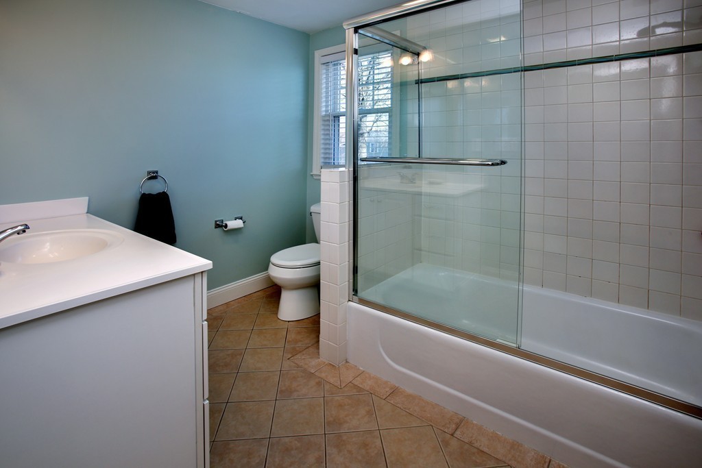 55 Bay State Road Arlington, MA 02474 - Photo 9 of 20 a bathroom with a shower and a toilet