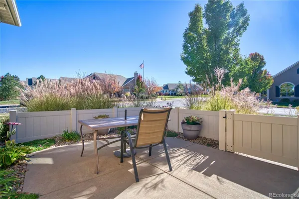 a view of a patio in a backyard