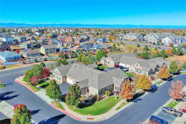 an aerial view of a house with a swimming pool yard and outdoor seating