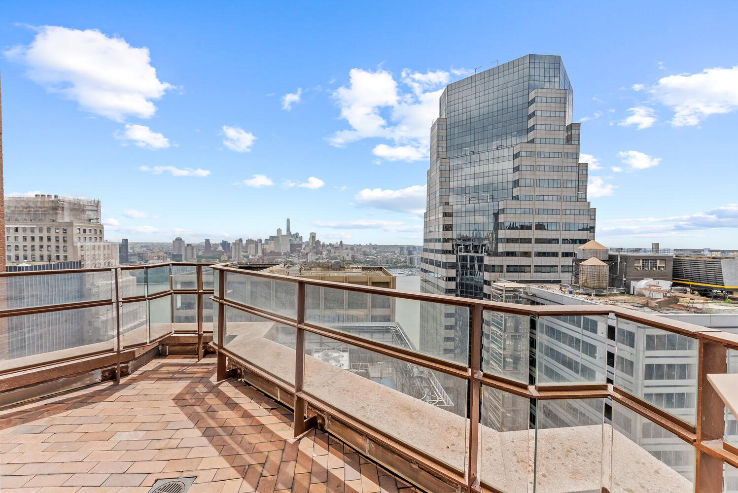 75 Wall Street, Unit 34C Manhattan, NY 10005 - Photo 12 of 26 a view of a city with tall buildings