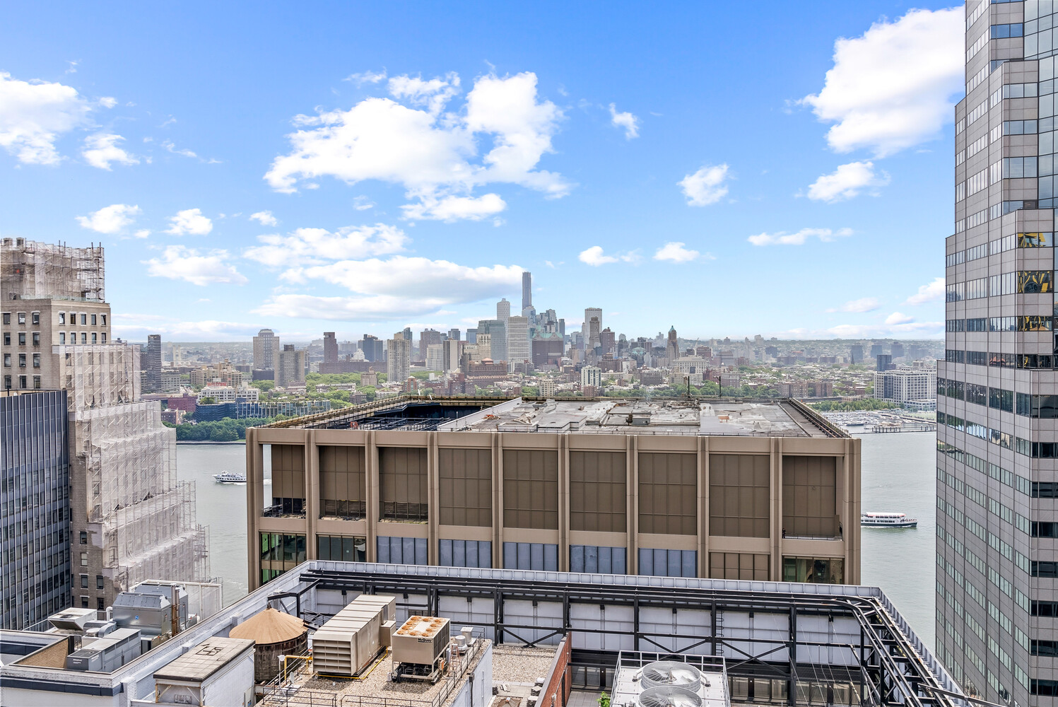 75 Wall Street, Unit 34C Manhattan, NY 10005 - Photo 13 of 26 a view of a city that has tall buildings