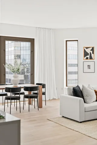 a view of a dining room with furniture and window