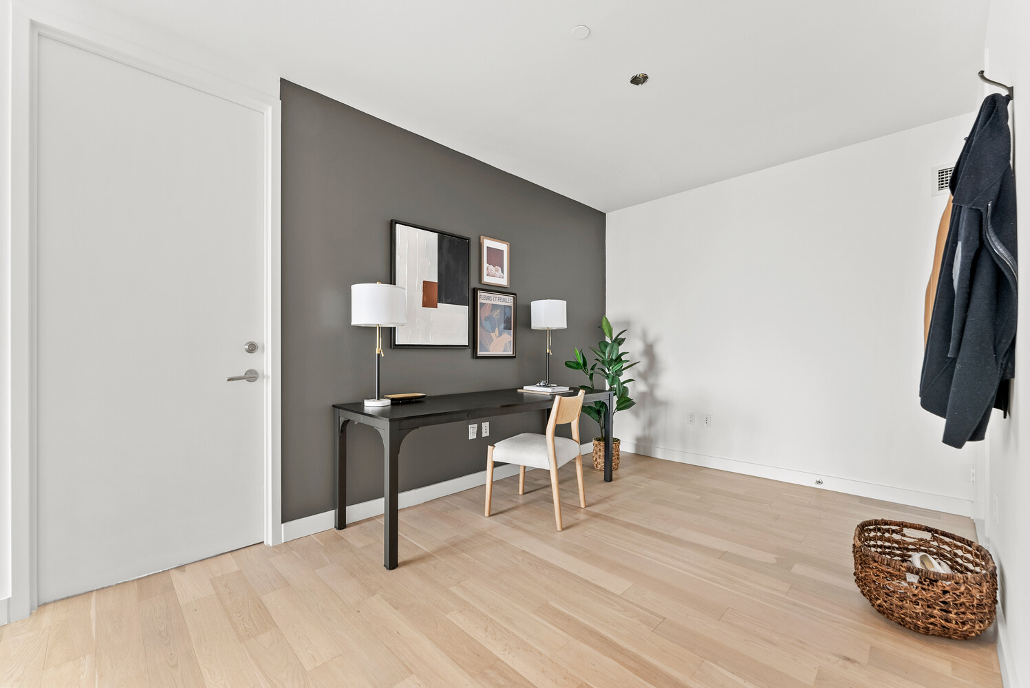 75 Wall Street, Unit 34C Manhattan, NY 10005 - Photo 7 of 26 a workspace with furniture and wooden floor