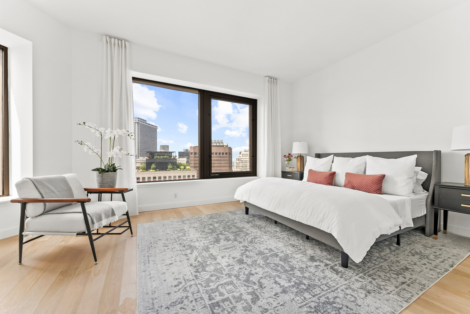 75 Wall Street, Unit 34C Manhattan, NY 10005 - Photo 8 of 26 a bedroom with a bed and large window