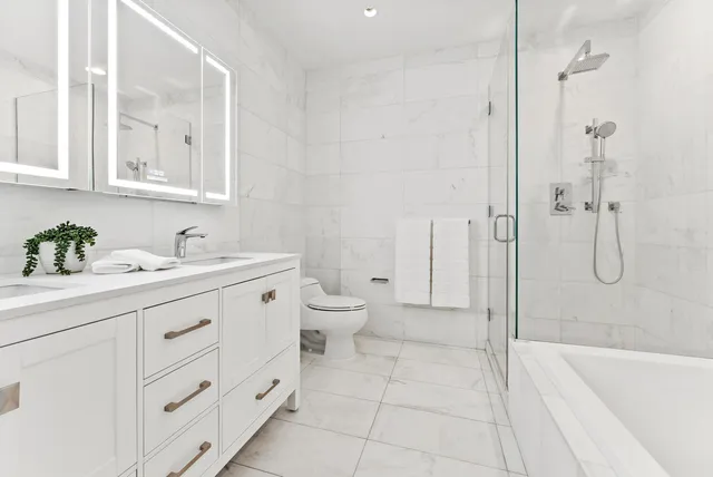 a bedroom with a bed and large window