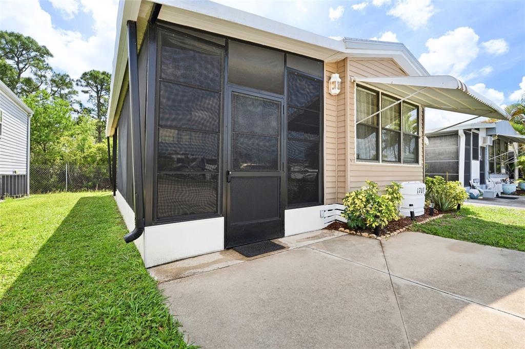 1703 North Manatee Loop Punta Gorda, FL 33950 - Photo 17 of 21 a house with a garden in front of it