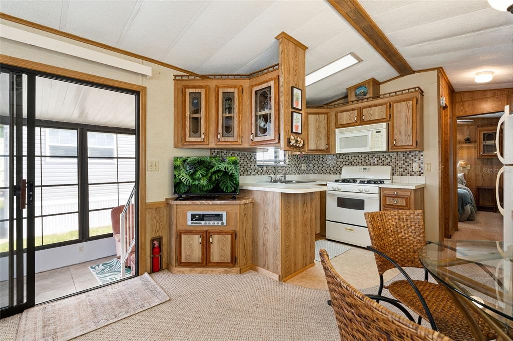 1703 North Manatee Loop Punta Gorda, FL 33950 - Photo 20 of 21 a kitchen with stainless steel appliances granite countertop a stove and a refrigerator