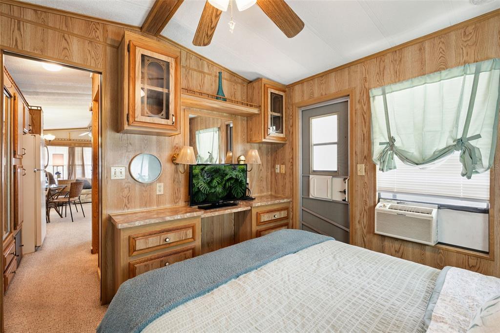 1703 North Manatee Loop Punta Gorda, FL 33950 - Photo 6 of 21 a bedroom with a bed and a flat tv screen on dresser