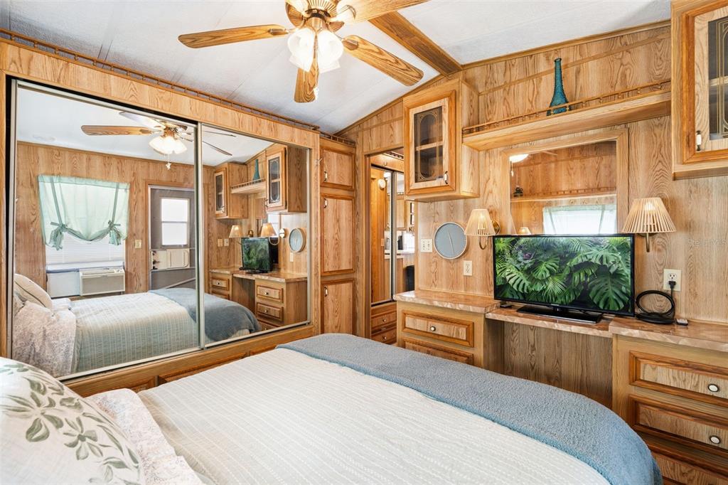 1703 North Manatee Loop Punta Gorda, FL 33950 - Photo 8 of 21 a bedroom with a large bed and chandelier