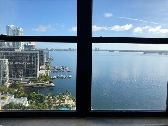a view of an empty room with glass door