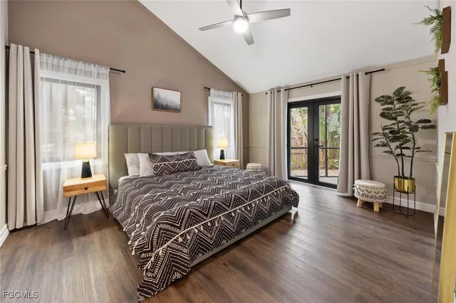 a bedroom with a bed and a view of living room