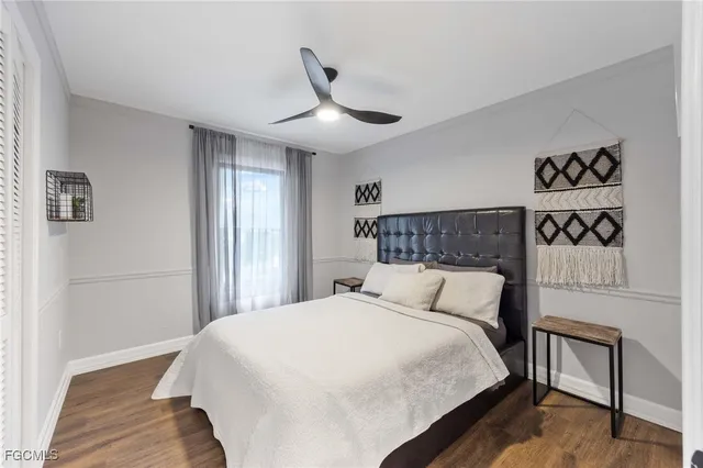 a bathroom with a bathtub shower sink mirror and toilet