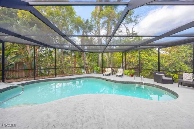 a view of swimming pool with outdoor seating
