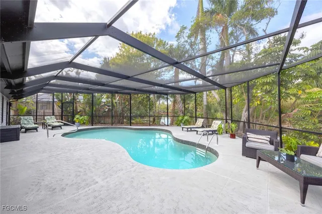 a building outdoor space with couches and potted plants