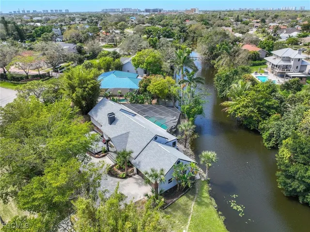 an aerial view of a house with a yard and garden