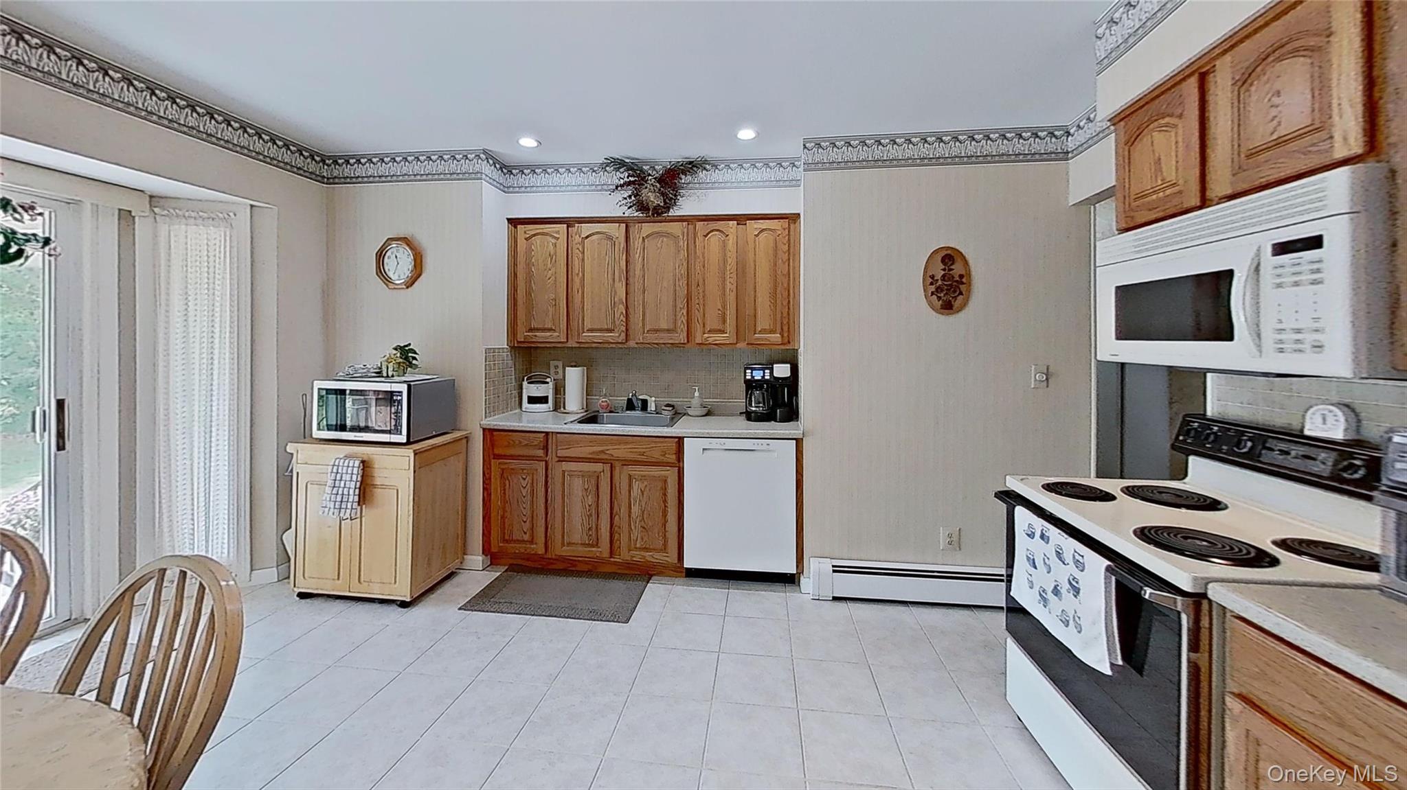 347 Miller Place Road Miller Place, NY 11764 - Photo 7 of 29 The Kitchen is spacious and very functional…with great seasonal views!