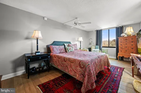 a bed room with a bed and a lamp