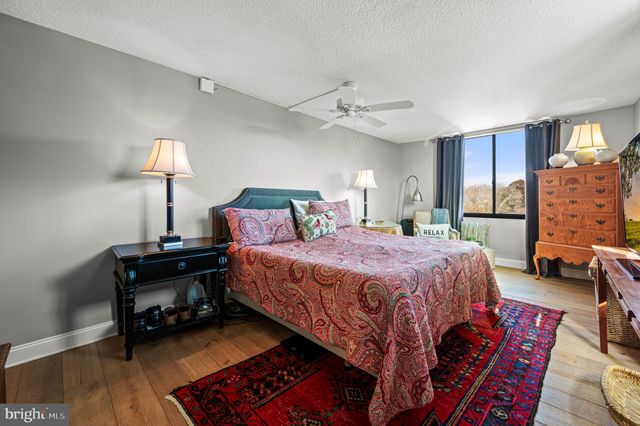 a bed room with a bed and a lamp