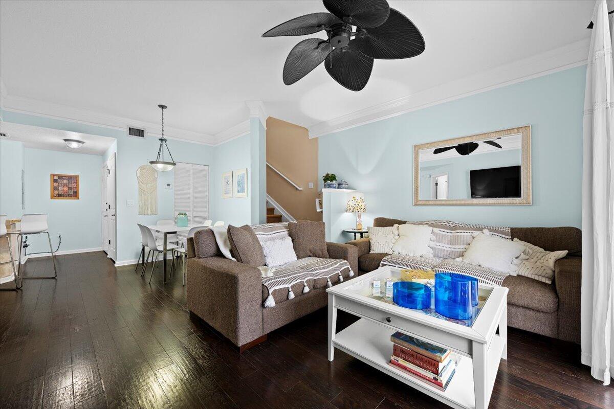 155 Galicia Way, Unit 202 Jupiter, FL 33458 - Photo 10 of 30 a living room with furniture and wooden floor