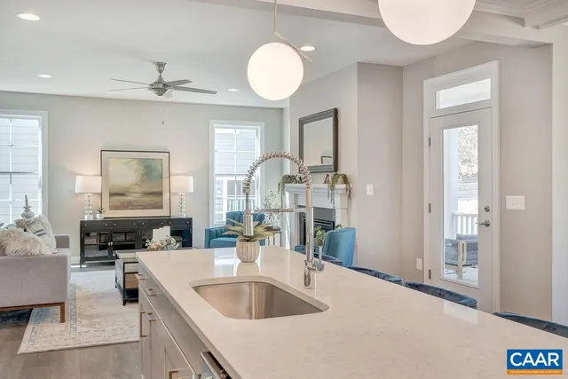 a kitchen with a refrigerator and a sink