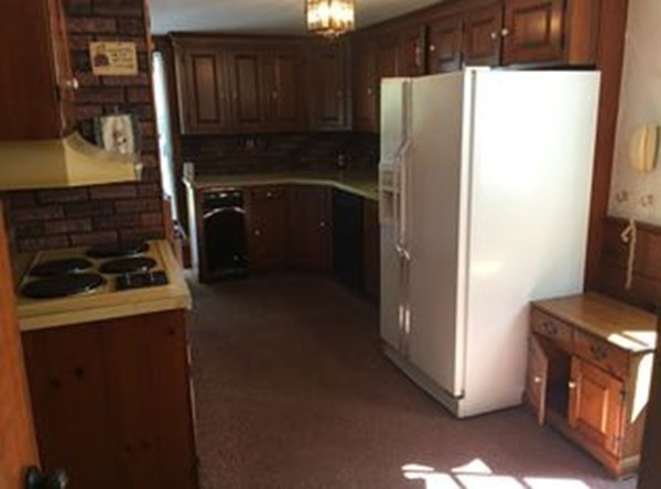 25 Arbor Road Chelmsford, MA 01863 - Photo 5 of 16 a kitchen with a refrigerator and a stove