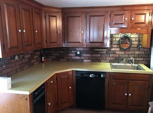 25 Arbor Road Chelmsford, MA 01863 - Photo 9 of 16 a kitchen with a sink and cabinets
