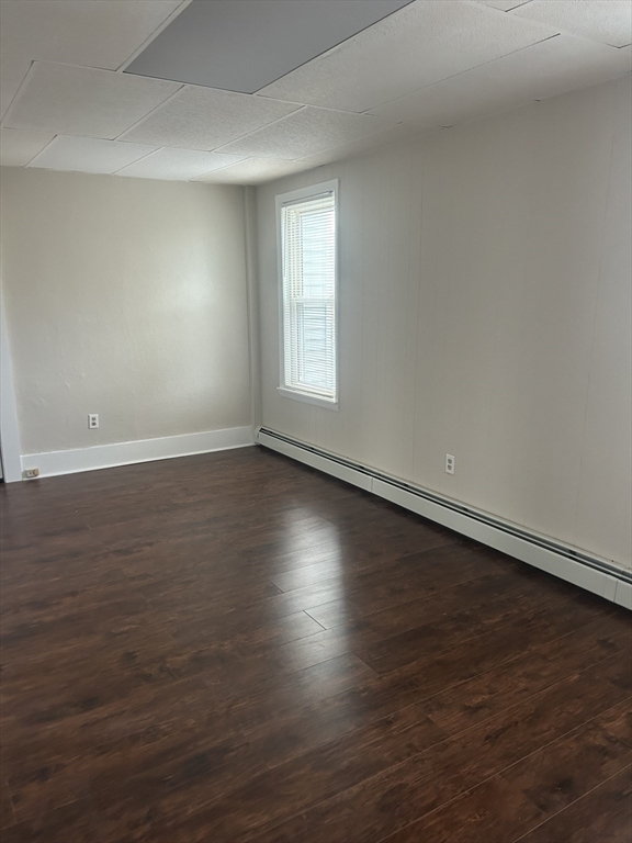 17 Abington Street, Unit 3 Worcester, MA 01603 - Photo 15 of 23 an empty room with wooden floor and windows