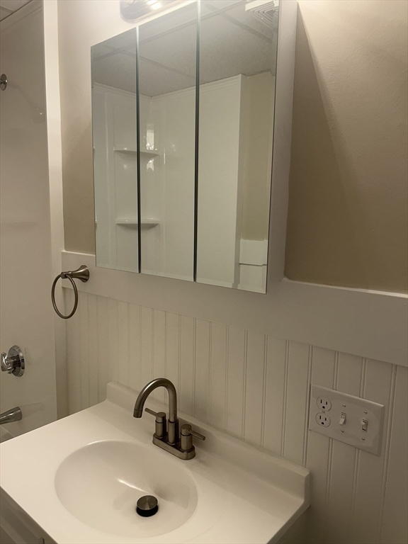 17 Abington Street, Unit 3 Worcester, MA 01603 - Photo 21 of 23 a bathroom with a sink and mirror