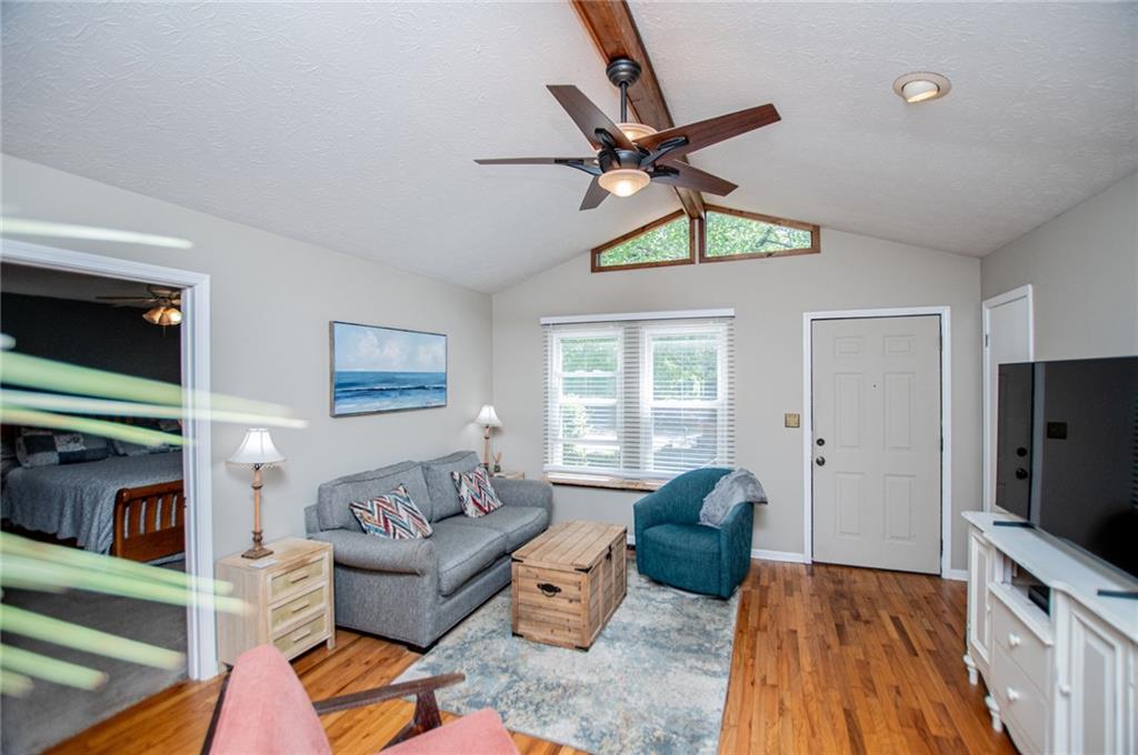1385 Lakeview Parkway Villa Rica, GA 30180 - Photo 23 of 71 a living room with furniture a ceiling fan and a window